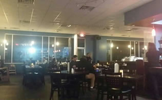 Kumo Sushi restaurant dining room with guests seated at tables